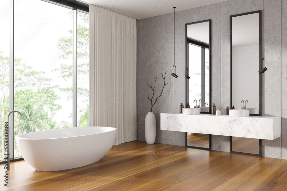 Corner view on bright bathroom interior with double sink, bathtub Corner view on bright bathroom interior with double sink, bathtub