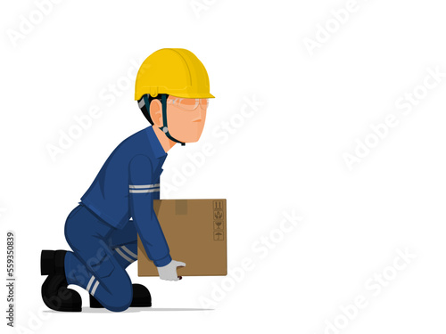 A worker is lifting a small box on the floor