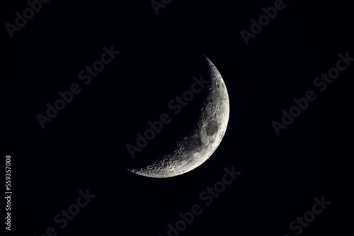 new moon in a black sky in detail photo