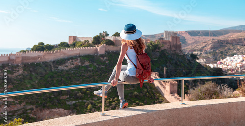 Woman tourist looking at Alcazaba of Almeria- Andalusia in Spain