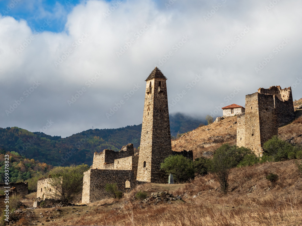 An ancient city on a rock. Medieval tower complex Egical, one of the authentic medieval castle-type tower villages, located on the extremity of the mountain range in Ingushetia, Russia. An ancient city on a rock. Medieval tower complex Egical, one of the authentic medieval castle-type tower villages, located on the extremity of the mountain range in Ingushetia, Russia.
