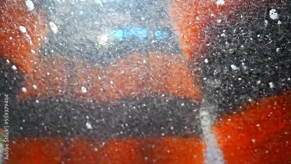 Inside view of a car being washed on an automatic machine. Automatic car washing from inside.