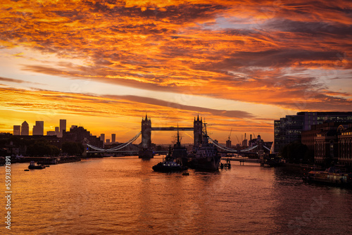 Beautiful sunrise behind the skyline of London, England, with the famous Tower Bridge and River Thames