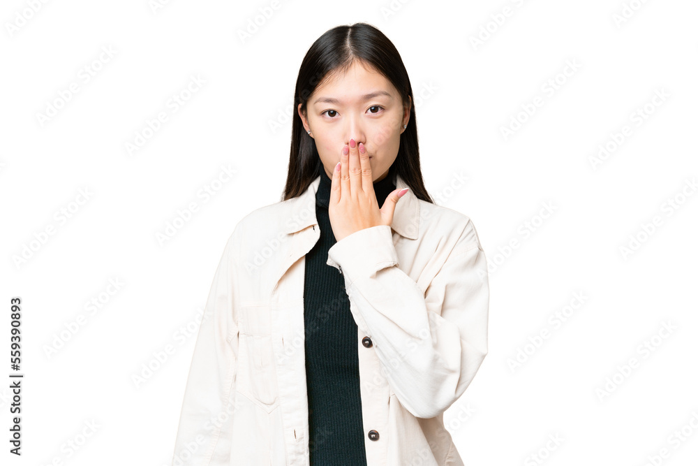 Young Asian woman over isolated chroma key background covering mouth with hand Young Asian woman over isolated chroma key background covering mouth with hand