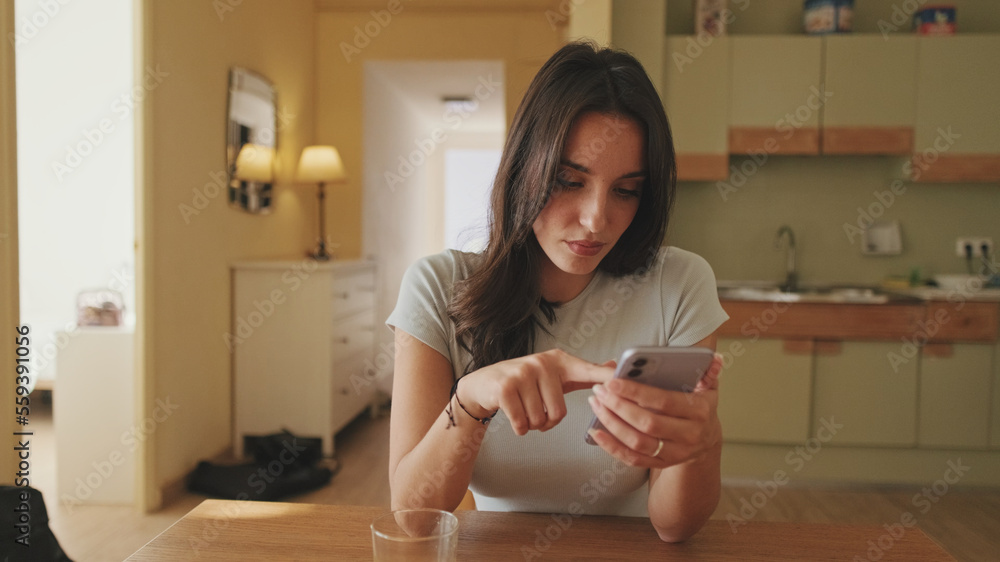 Close-up of girl's hands scrolling through photos and videos on her smartphone Close-up of girl's hands scrolling through photos and videos on her smartphone