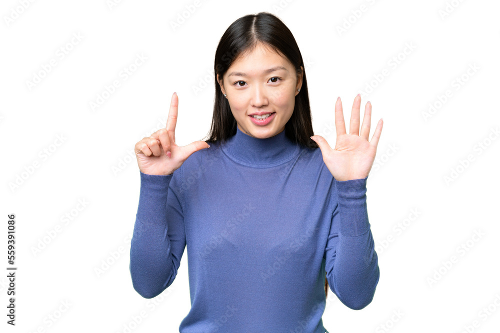 Young Asian woman over isolated chroma key background counting seven with fingers Young Asian woman over isolated chroma key background counting seven with fingers