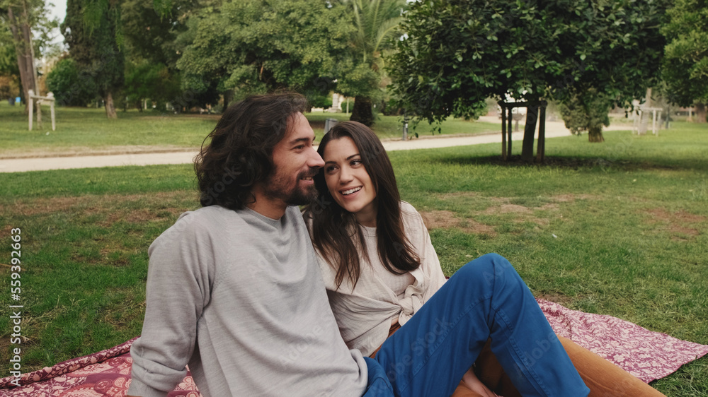 Close up, love couple hugging on lawn Close up, love couple hugging on lawn