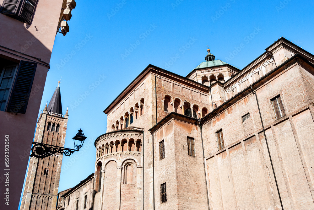 A detail of the bell tower and the apse of the Romanesque Cathedral of Parma, dedicated to the Assumption of the Blessed Virgin Mary, in Emilia Romagna region, Italy.