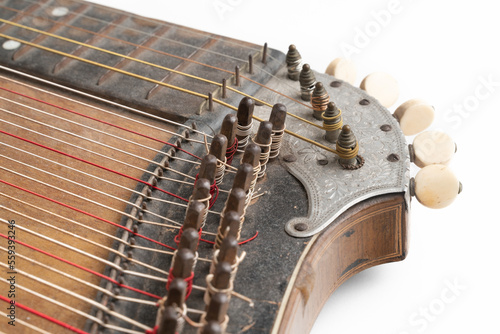 Tableau sur toile High angle studio shot of vintage, old wooden zither isolated on white background
