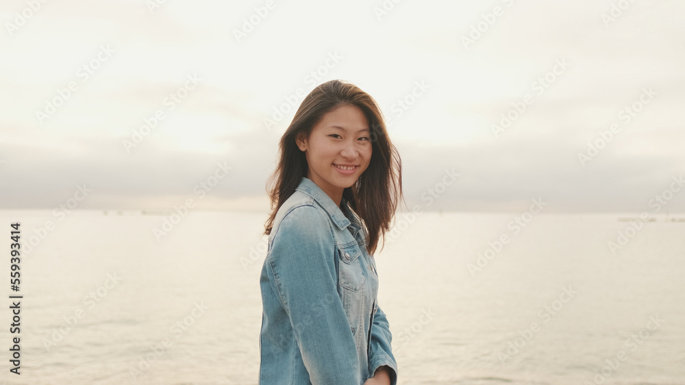 Close-up of laughing beautiful young woman looking at camera Close-up of laughing beautiful young woman looking at camera