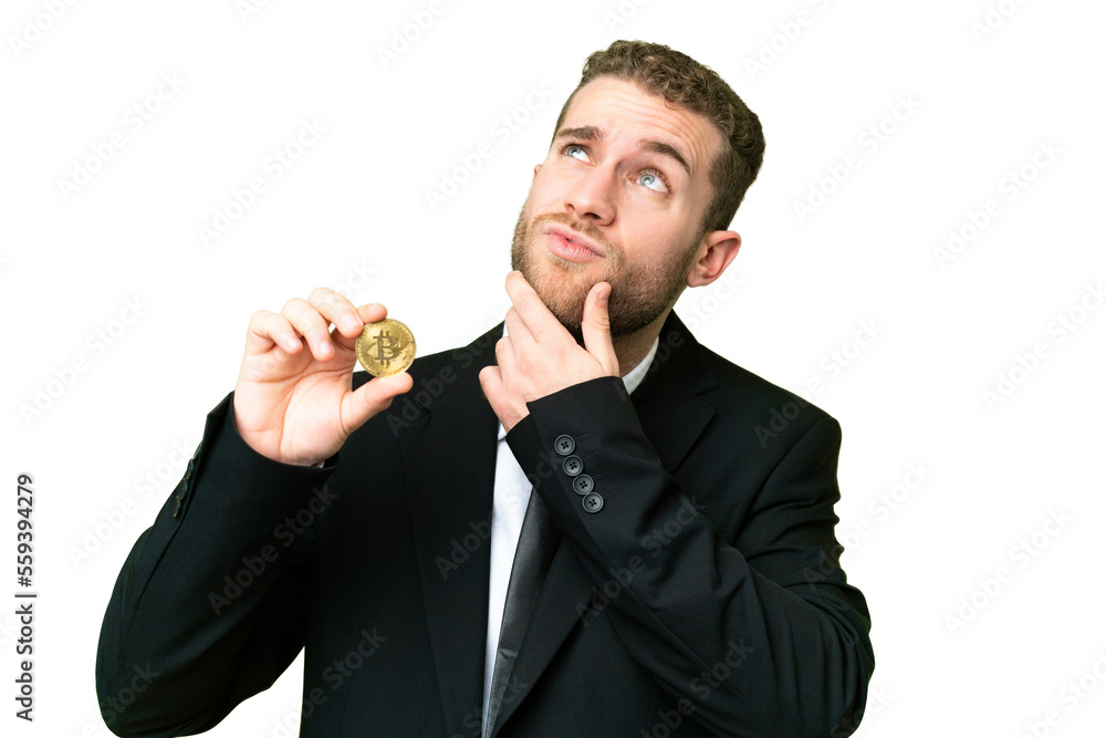 Young business blonde man holding a Bitcoin over isolated chroma key background having doubts Young business blonde man holding a Bitcoin over isolated chroma key background having doubts