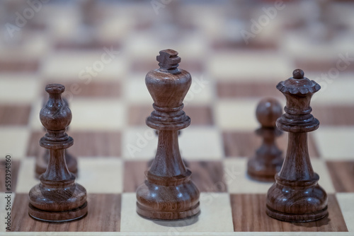 Wooden chess on the chessboard