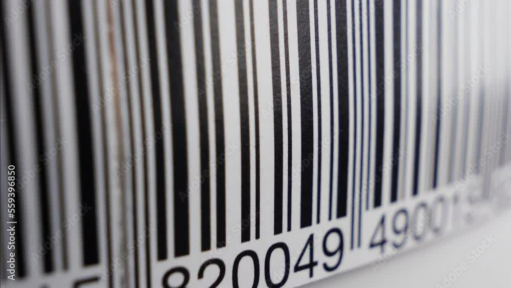 Barcode label scanning with red laser strip. Production line, close up shot Barcode label scanning with red laser strip. Production line, close up shot