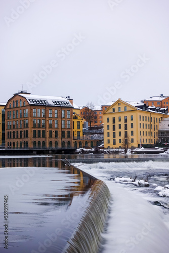The river Motala Ström (Strömmen) by old industrial buildings, a landmark of Norrköping, Sweden photo