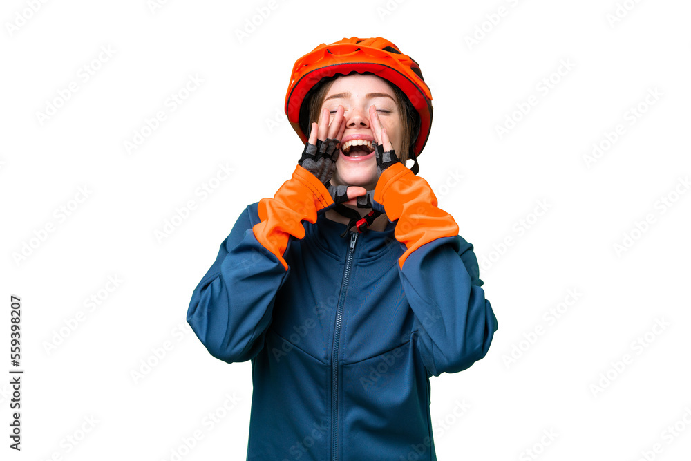 Young cyclist woman over isolated chroma key background shouting and announcing something Young cyclist woman over isolated chroma key background shouting and announcing something