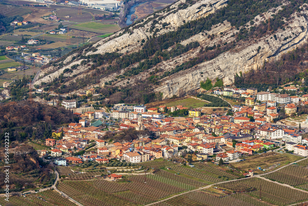 Aerial view of the small village of Nago-Torbole view from the mountain range of Monte Baldo (Monte Altissimo di Nago, Sentiero della Pace). Trento province, Trentino Alto Adige, Italy, Europe.