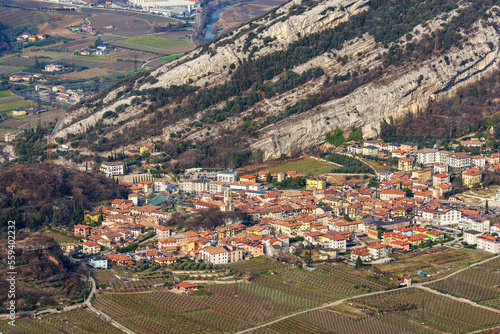 Aerial view of the small village of Nago-Torbole view from the mountain range of Monte Baldo (Monte Altissimo di Nago, Sentiero della Pace). Trento province, Trentino Alto Adige, Italy, Europe. photo