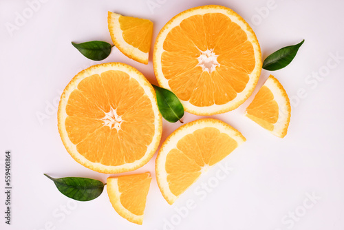 Fresh orange citrus fruit with leaves on white background 
