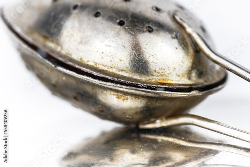 Close-up of an old metal tea spoon photo