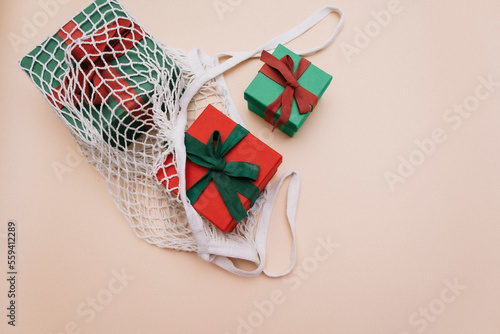 Zero waste, sustainable, green, eco-friendly holiday Eco-friendly mesh shopping bag with Gift boxes. Mesh Reusable Cotton Grocery Bag with Gifts