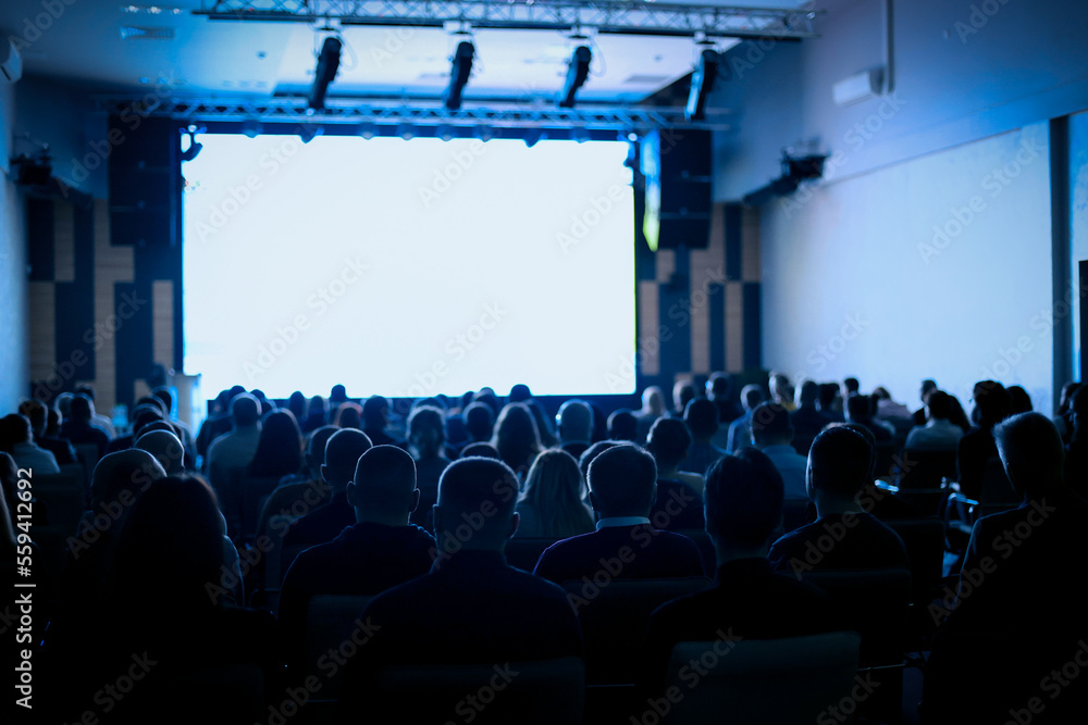 custom made wallpaper toronto digitalBack view of Audience listening speakers in the conference hall or seminar meeting, business and education about investment concept