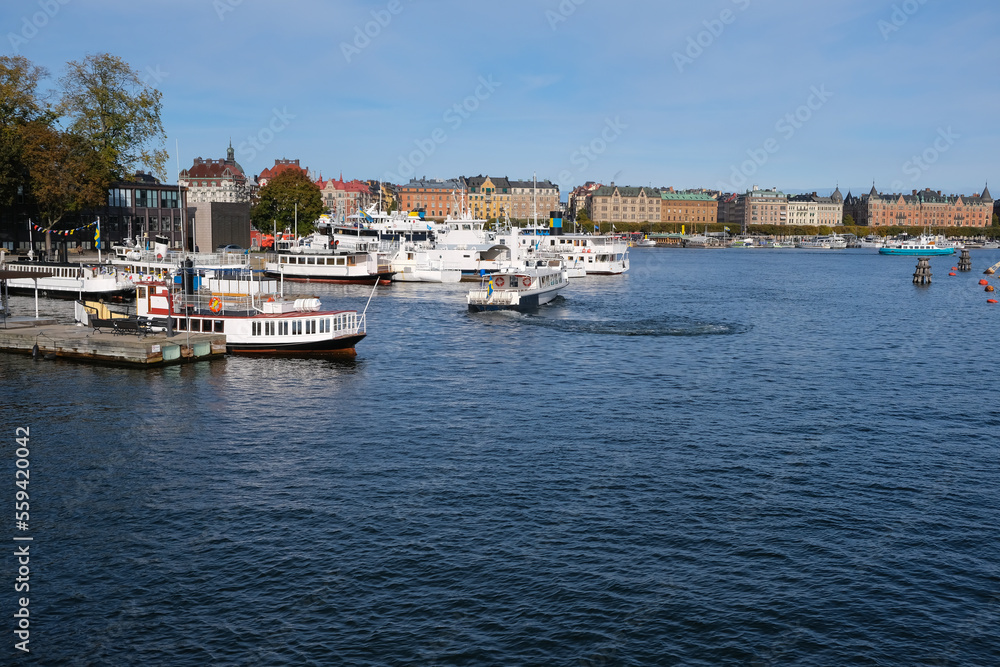 A boat sails in marina in Stockholm, Sweden