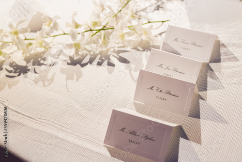 Wedding Invitation card mockup in the white table with flowers