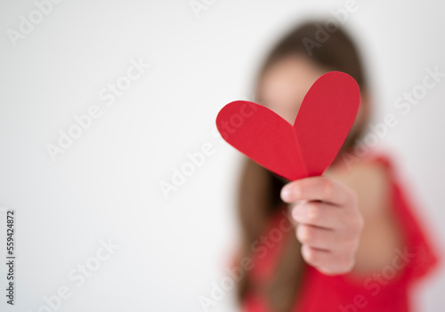 cute girl holding paper hearts, st.Valentines day concept