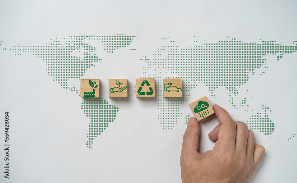 Hand array CO2 reducing ,Recycle ,Green factory icon on world map for decrease CO2 , carbon footprint and carbon credit to limit global warming from climate change, Bio Circular Green Economy concept. - obrazy, fototapety, plakaty 
