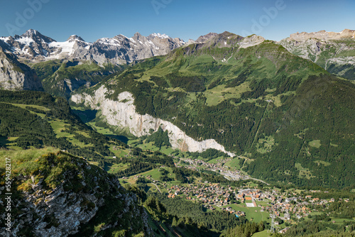 Fototapeta Naklejka Na Ścianę i Meble -  Aerial view of Lauterbrunnen valley with mountain peaks in the Swiss Alps on a sunny summer day