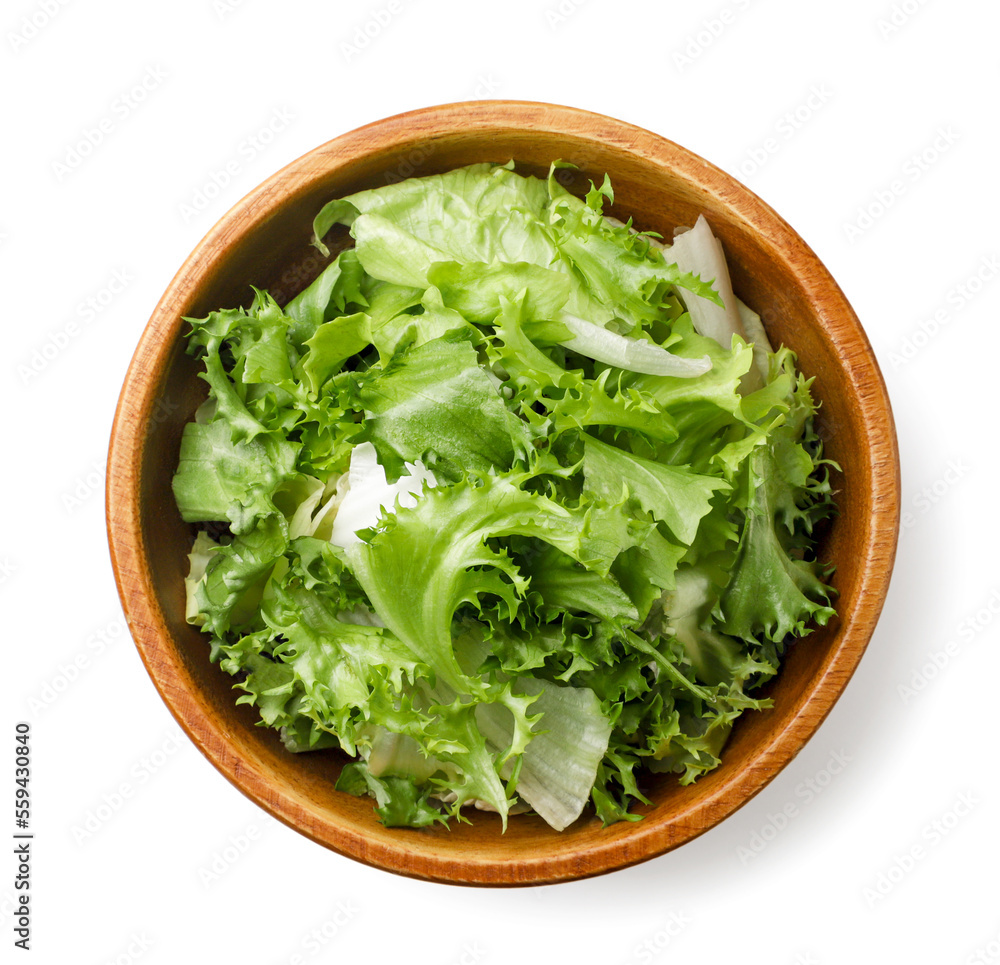 Lettuce leaves in a wooden plate on a white background. Top view Lettuce leaves in a wooden plate on a white background. Top view