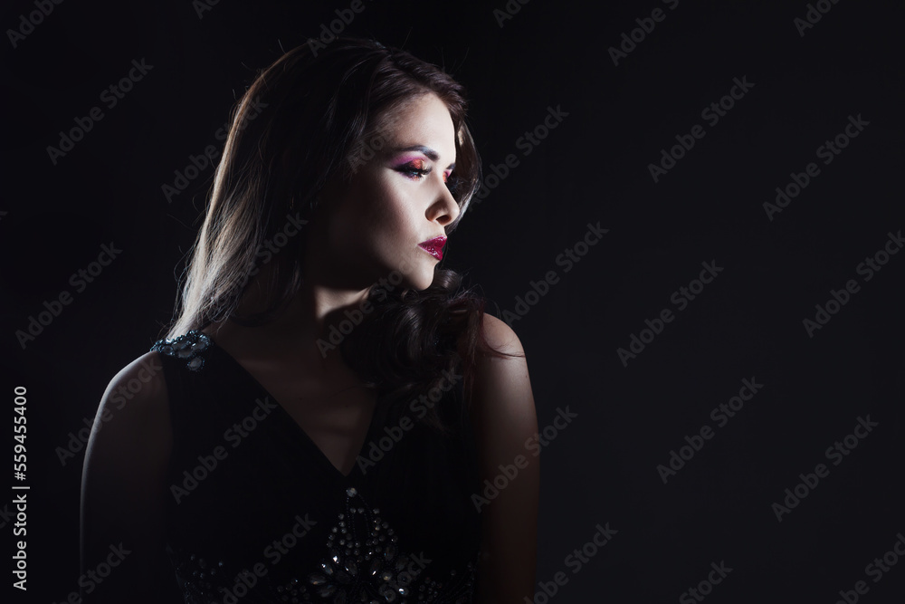 luxurious and mysterious beauty in Noir style, a portrait on a black background, deep shadows and a mysterious look. Fatal lady close-up luxurious and mysterious beauty in Noir style, a portrait on a black background, deep shadows and a mysterious look. Fatal lady close-up