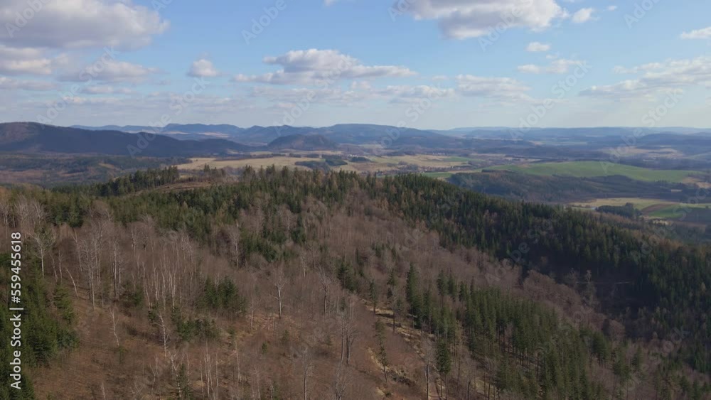 Aerial birds eye view of beautiful mountains covered with evergreen forest at sunny autumn day. Nature landscape with mountains ranges and valleys Aerial birds eye view of beautiful mountains covered with evergreen forest at sunny autumn day. Nature landscape with mountains ranges and valleys