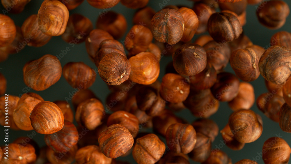 Freeze Motion Shot of Flying Whole Hazelnuts, Close-up Freeze Motion Shot of Flying Whole Hazelnuts, Close-up