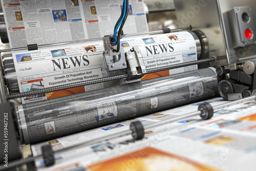 Newspaper or hournal with news printing on a printing machine in a typography. photo