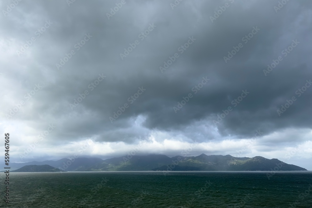 thunderstorm on the sea in the mountains, cloudy before rain