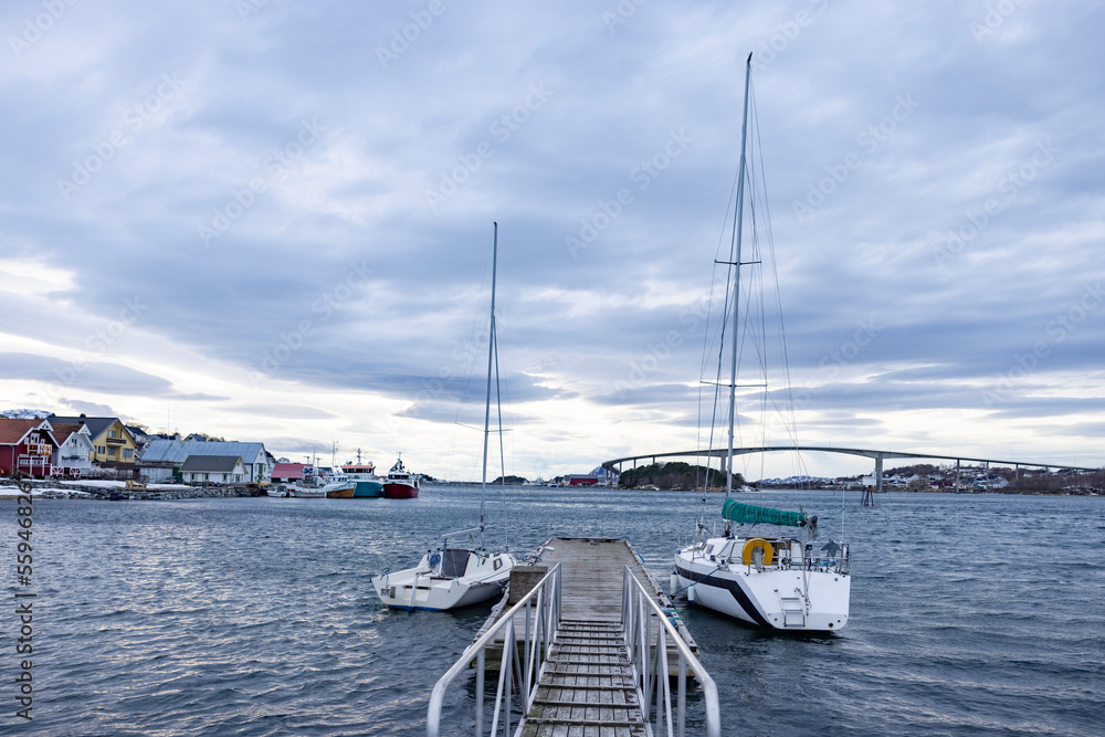 Fototapeta premium Fishing boatsand sailboats at the quay in Brønnøysund, Helgeland, Norway, Europe