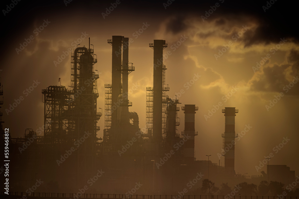 Oil refinery at sunset