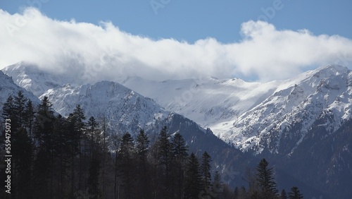 Fast motion clouds over snowy mountains