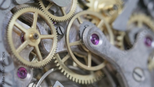 Vintage clock mechanism gear motion, macro close-up