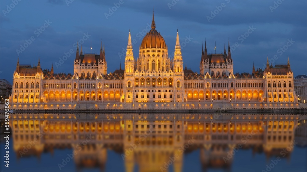 Budapest Parliament mirrored in Danube River at dusk Budapest Parliament mirrored in Danube River at dusk