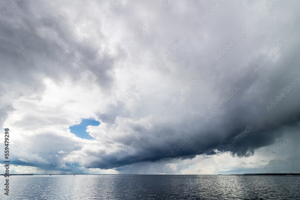 The sky before the rain. Storm clouds over the water. The sky before the rain. Storm clouds over the water.