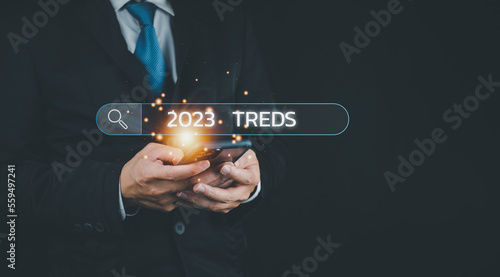 2023 business start up new year businessman using smartphone for ideas business keyword search for marketing and ideas make a business plan for the world