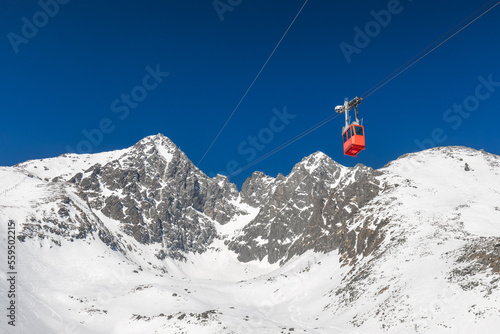 Snowy winter high mountain landscape. Cable car to The Lomnicky peak in High Tatras National Park, Slovakia, Europe.