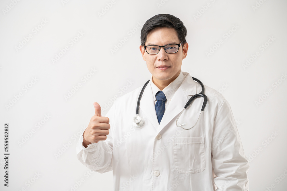 Portrait of confident Asian Doctor in glasses showing thumbs-up isolated on white background Portrait of confident Asian Doctor in glasses showing thumbs-up isolated on white background