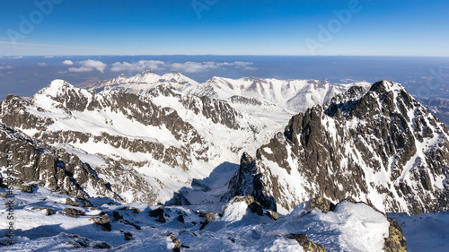 Snowy winter high mountain landscape. A panoramic view from the top of The Lomnicky peak in High Tatras National Park  Slovakia  Europe.