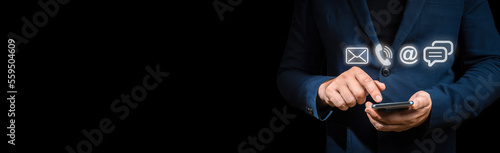 Fototapeta Naklejka Na Ścianę i Meble -  Contact Us. Businessman touching icon mobile phone, mail, telephone and address. Customer service call center contact us concept. wide web banner. copy space