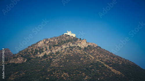 Udaipur, Rajasthan, India 1st January 2023: The Monsoon Palace, SajjanGarh Palace in the city of Udaipur. Forts of Rajasthan. Located on a Bansdara peak of Aravalli hill. Udaipur Tourism. photo