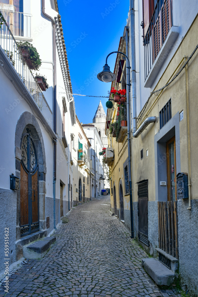 Fototapeta premium A narrow street among the old houses of Melfi, a village in the province of Potenza in Italy.