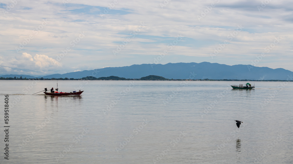 Fishermen sail boats with flying bird in Kung Krabaen, Chanthaburi Fishermen sail boats with flying bird in Kung Krabaen, Chanthaburi